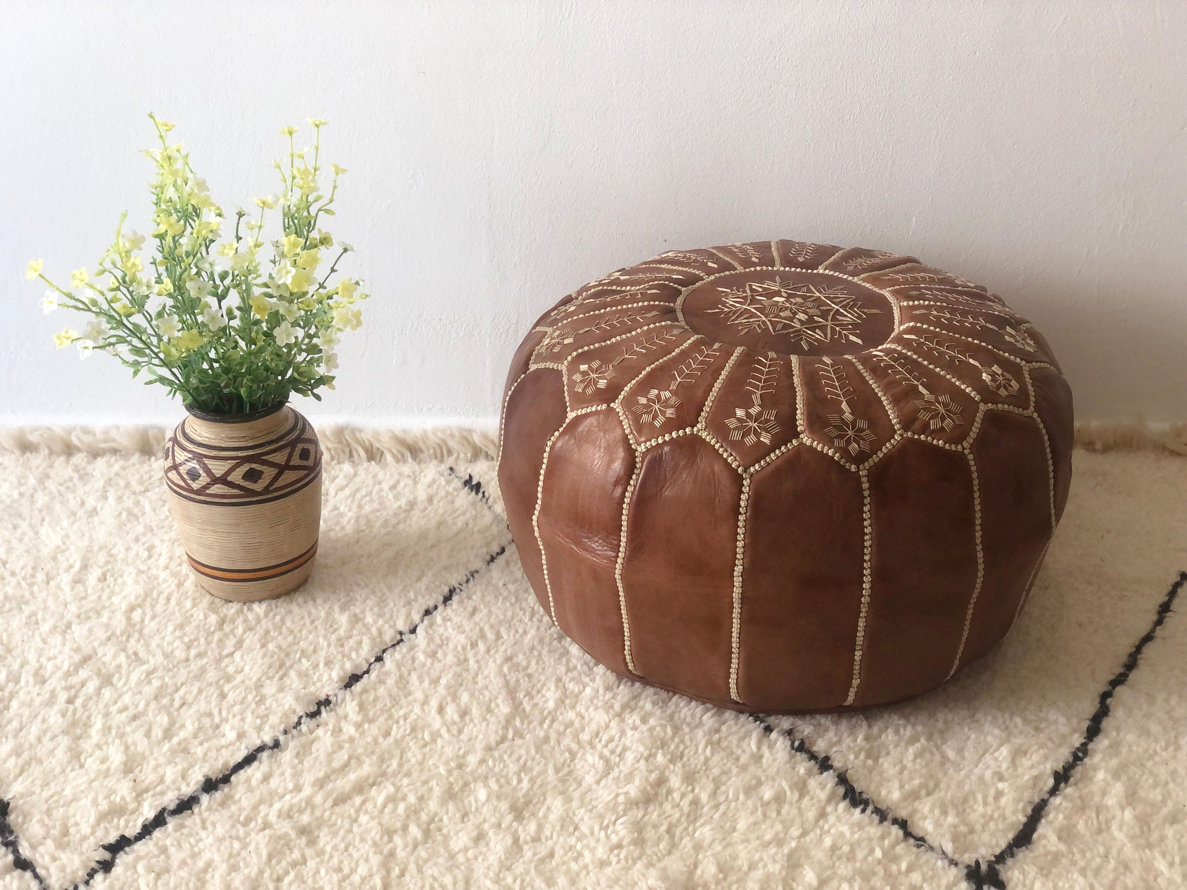 Moroccan-style brown leather pouf