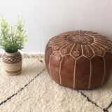 Moroccan-style brown leather pouf