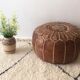 Moroccan-style brown leather pouf