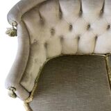 Vintage green two-seater sofa with fringes