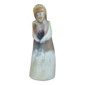 Religious statuette in ancient horn