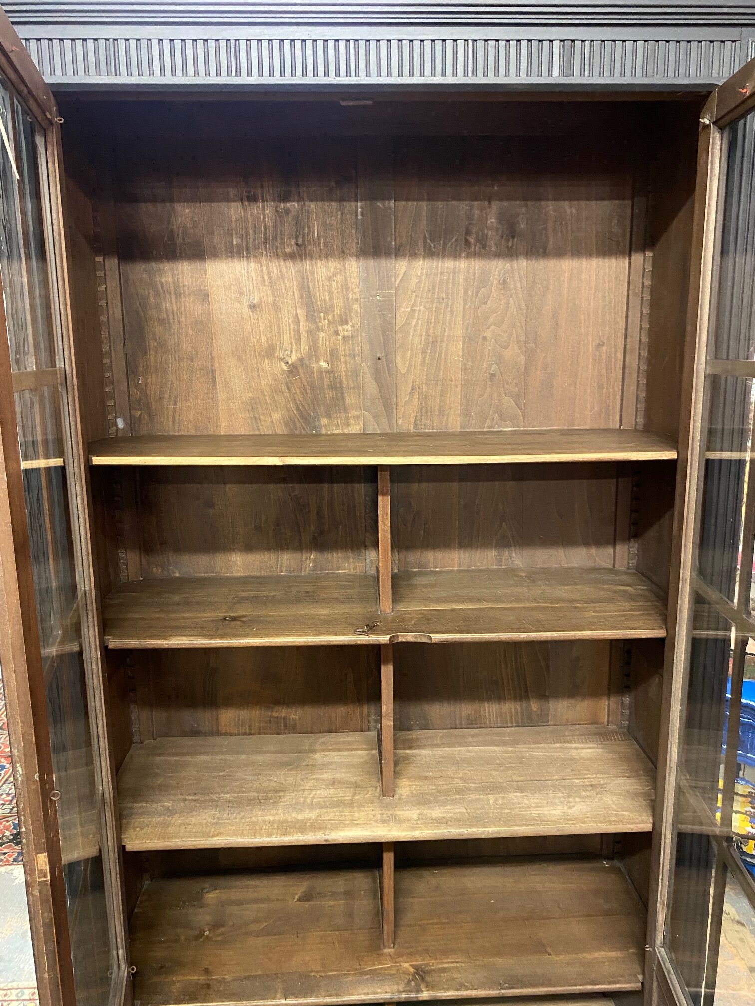 Black bookcase with glass doors