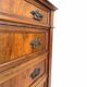 Antique walnut commode with bronze handles in the shape of a lion's mask,
