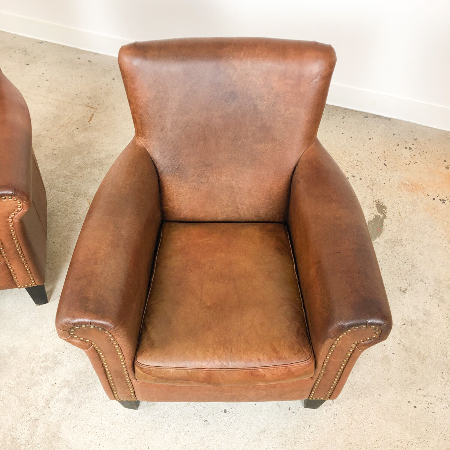 Set of two vintage leather armchairs