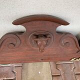 Log frontispiece with ox heads