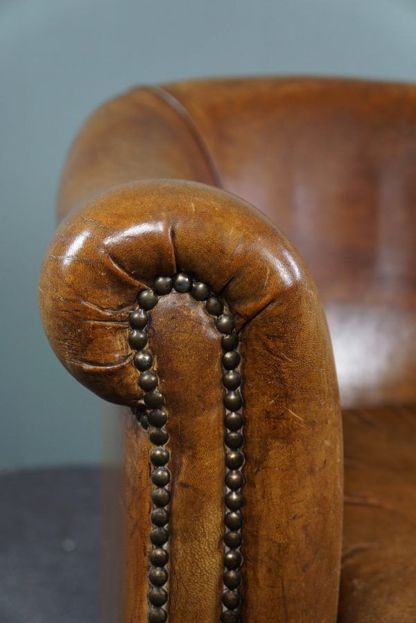 Club chair in patinated sheepskin