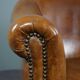 Club chair in patinated sheepskin