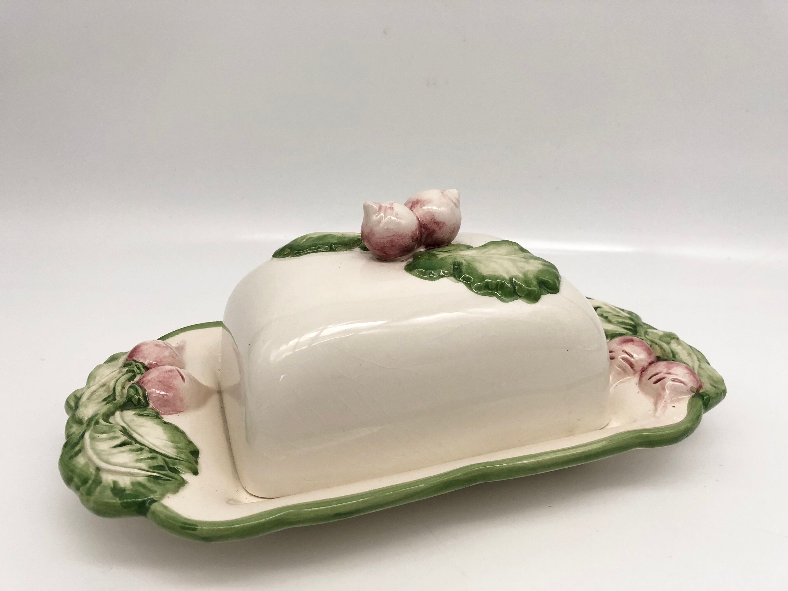 Slurry butter dish, with radish drawings. Signed "FG"
