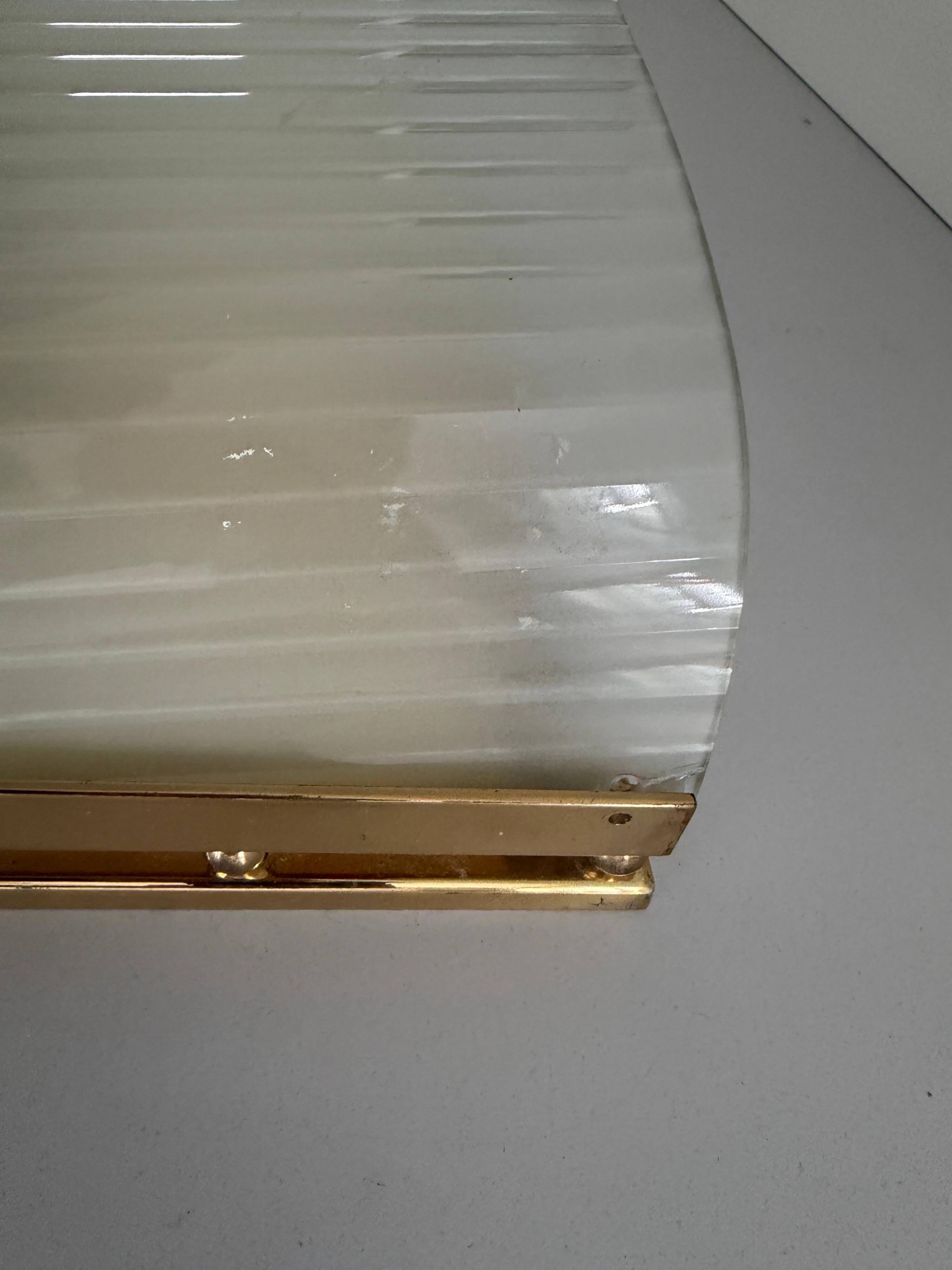 Large heavy glass wall light with a brass frame from the mid-century, 1950s, Italy.