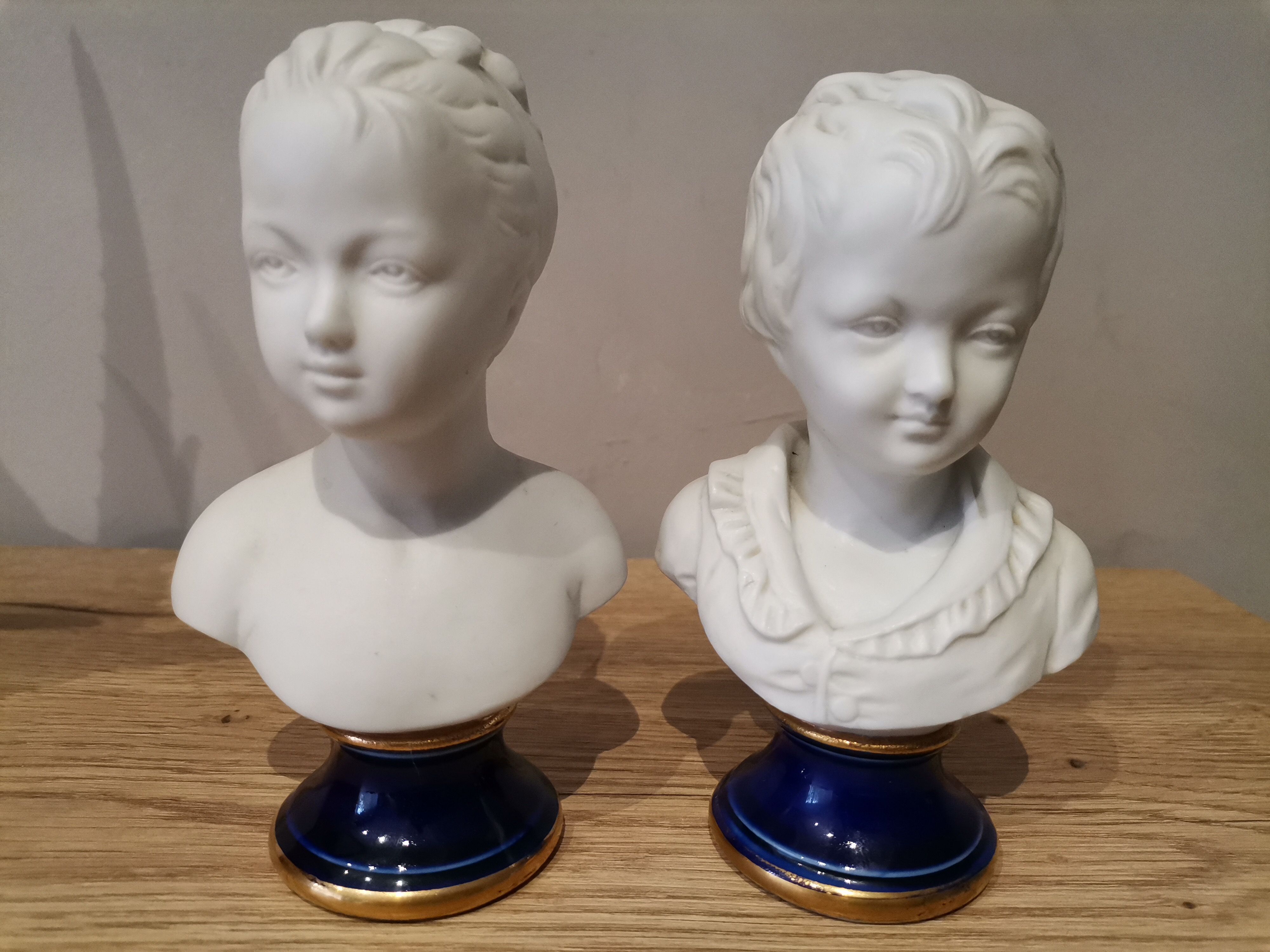 Signed children's busts