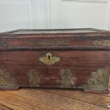 Old Indian wooden wedding chest decorated with chiseled brass plaque. India late 19th/early 20th