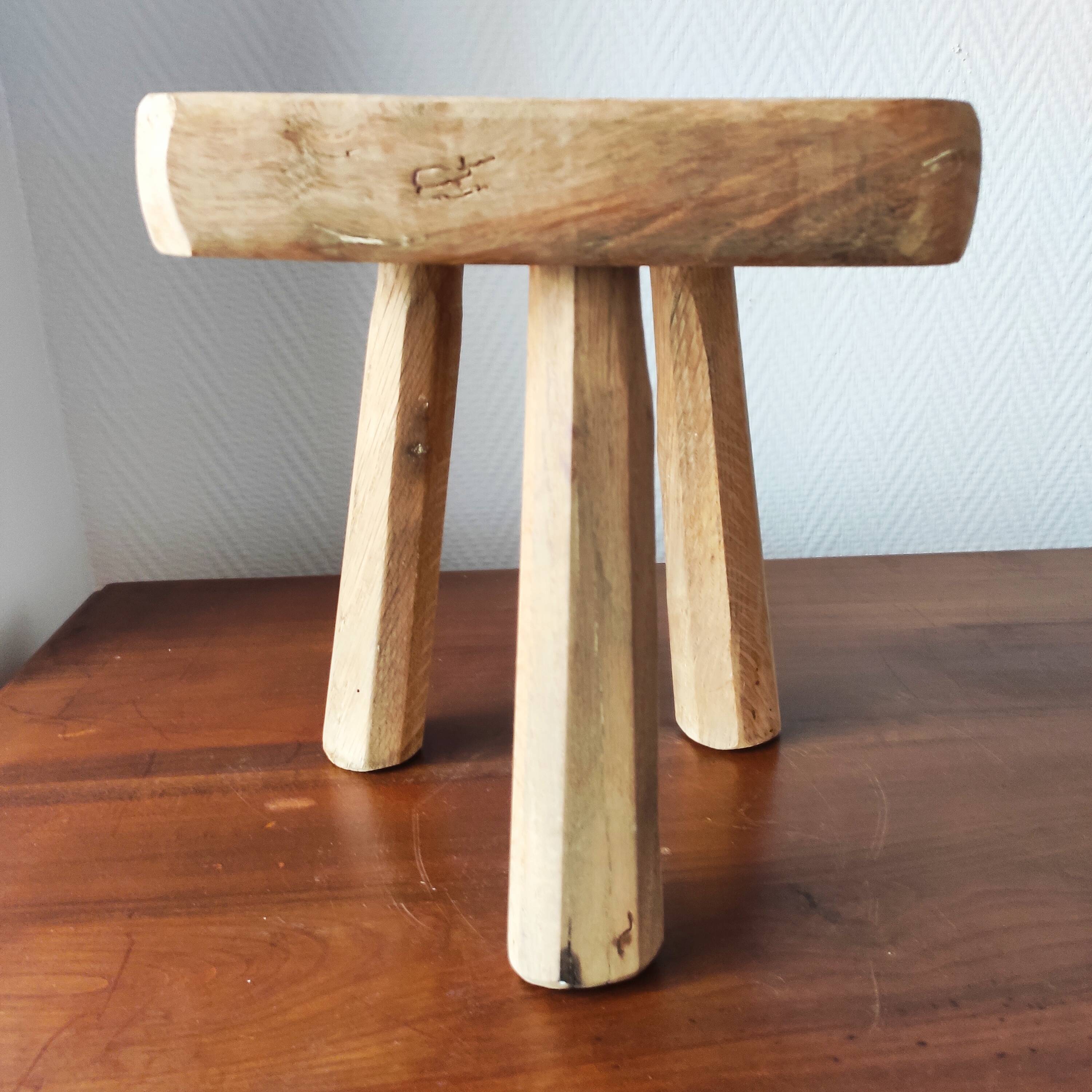 Vintage Danish brutalist tripod stool made of solid oak.