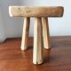 Vintage Danish brutalist tripod stool made of solid oak.