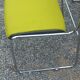 Set of 6 designer chairs with wooden seats and backs, chrome legs.