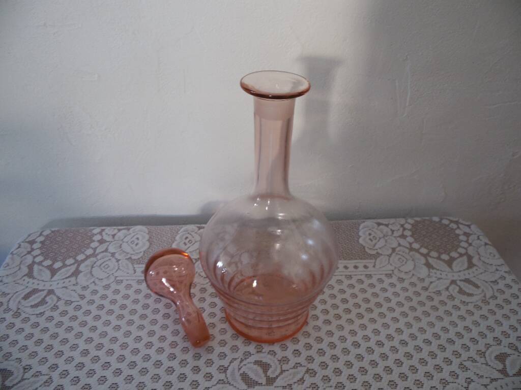 Pink transparent glass carafe with bubble cap