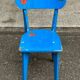 Child's chair in vintage or rustic wood style from the 1960s.