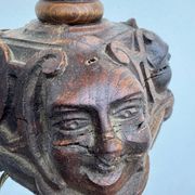 Sculpted wooden lamp with faces, antique.