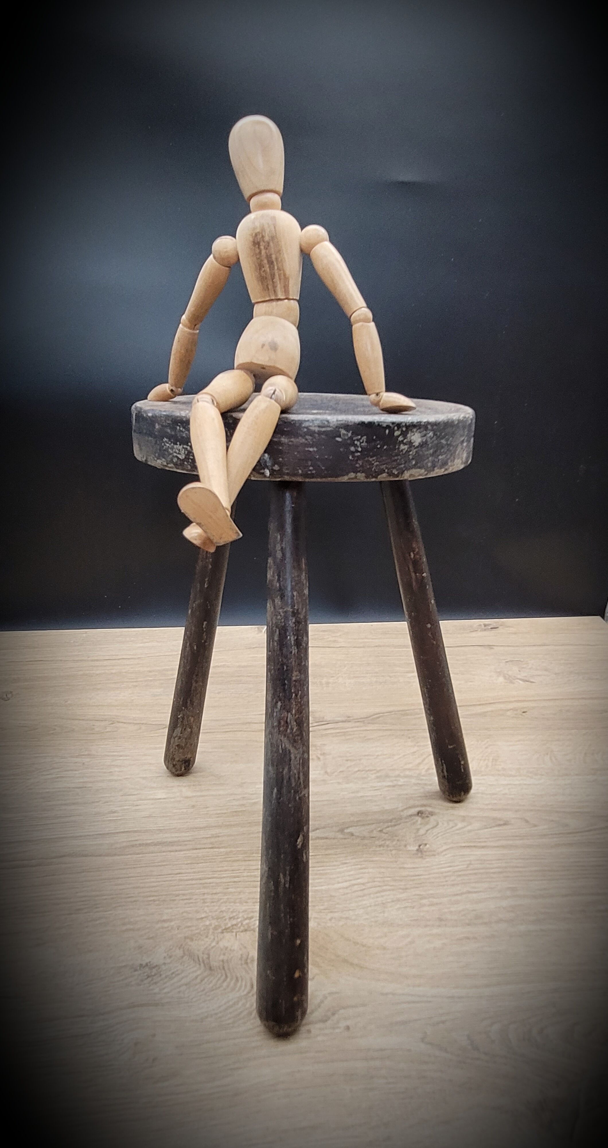 Massive black tripod stool