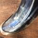 Polished beef horn on brass base
