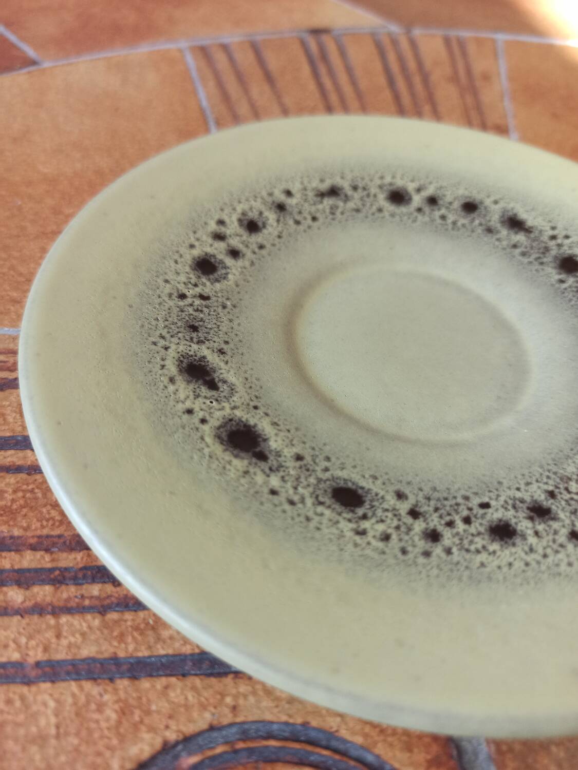 A pair of vintage glazed stoneware cups and saucers.