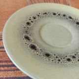 A pair of vintage glazed stoneware cups and saucers.