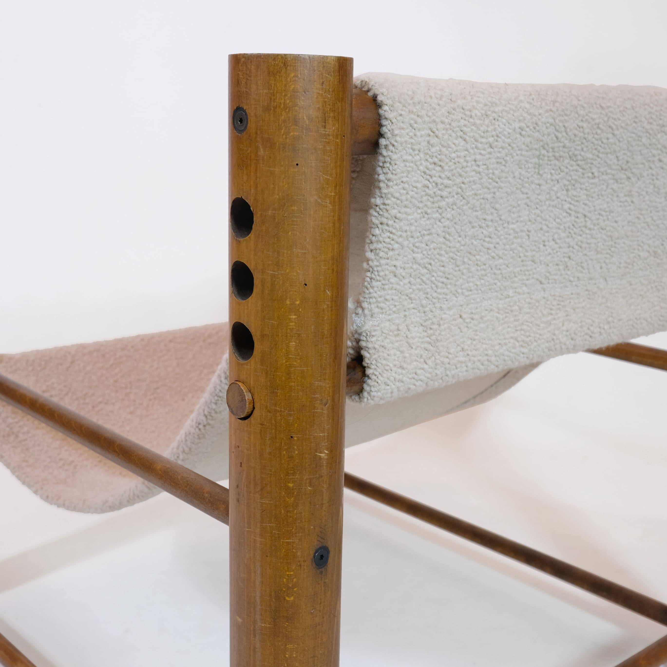 Solid wood armchair with adjustable backrest.