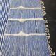 Handwoven Berber rug in blue and white, size 150x250 cm.