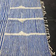 Handwoven Berber rug in blue and white, size 150x250 cm.