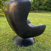 Egg chair style armchair and its ottoman.
