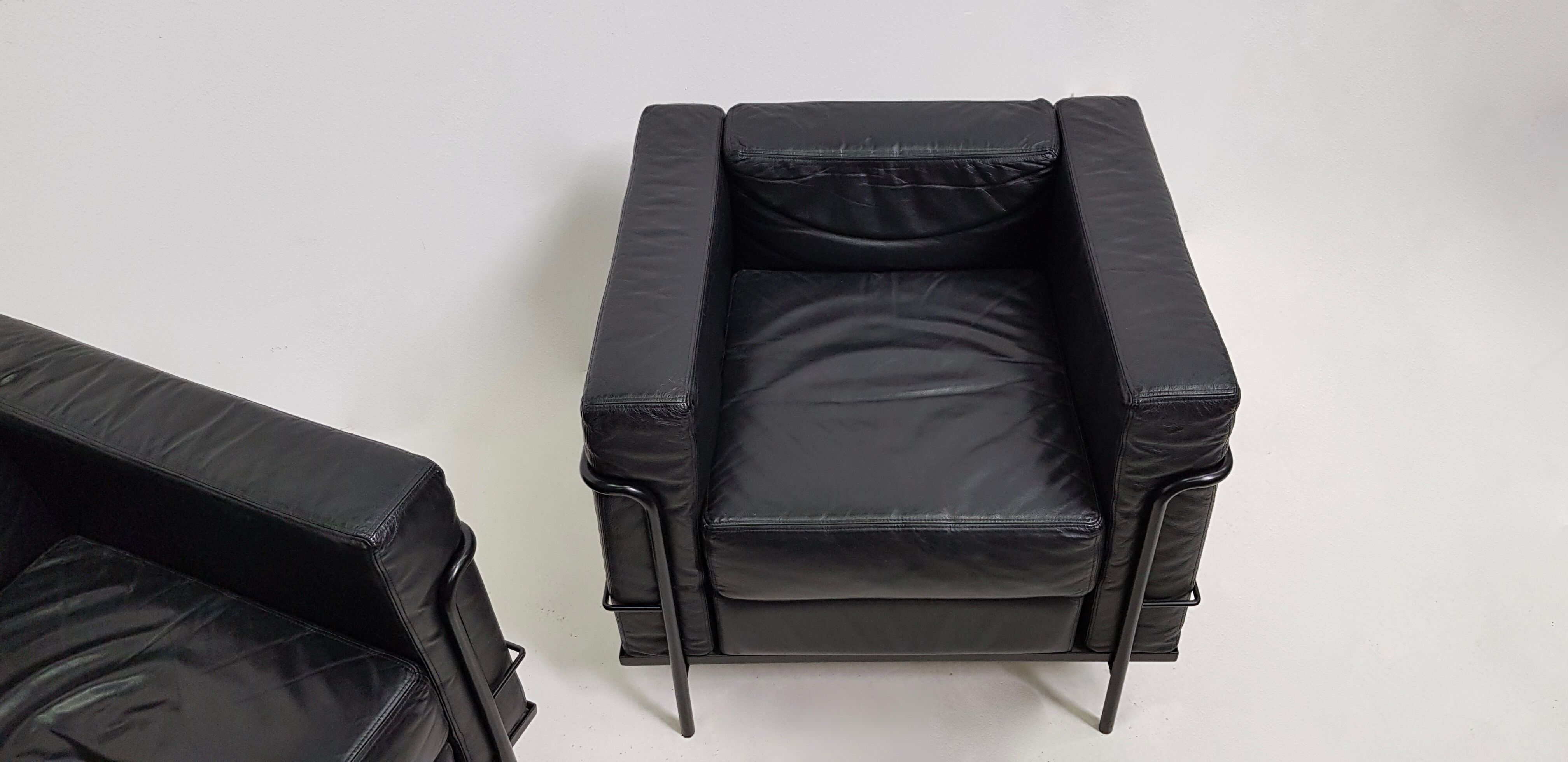 Pair of vintage armchairs Hugues Chevalier in leather 1980