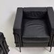 Pair of vintage armchairs Hugues Chevalier in leather 1980