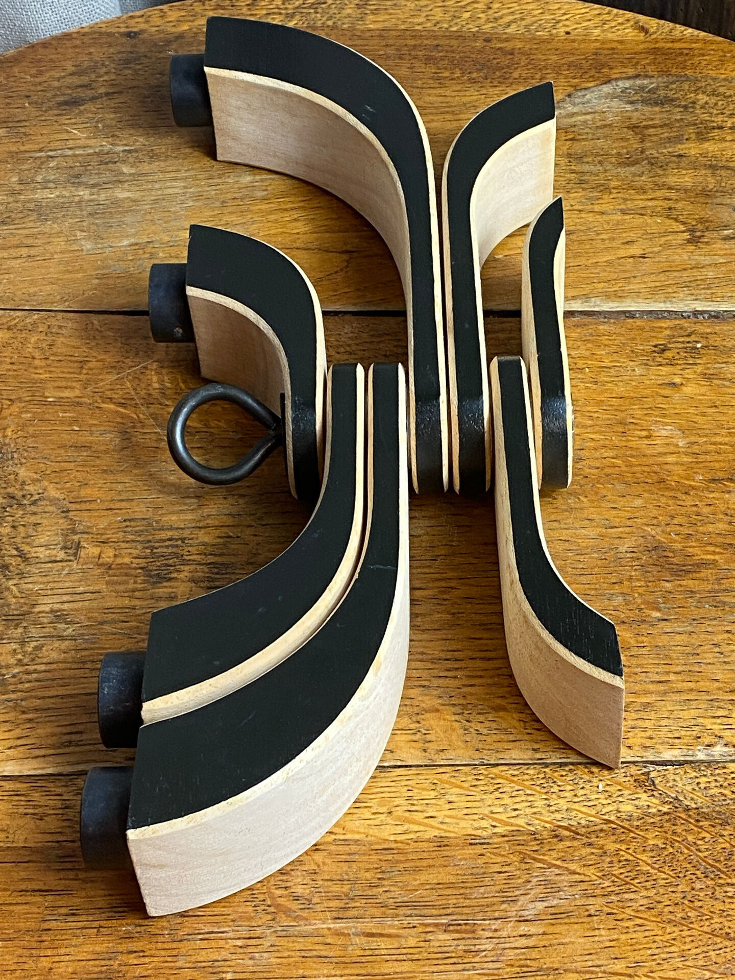 Foldable and deconstructed chandelier, minimalist Swedish design in wood.