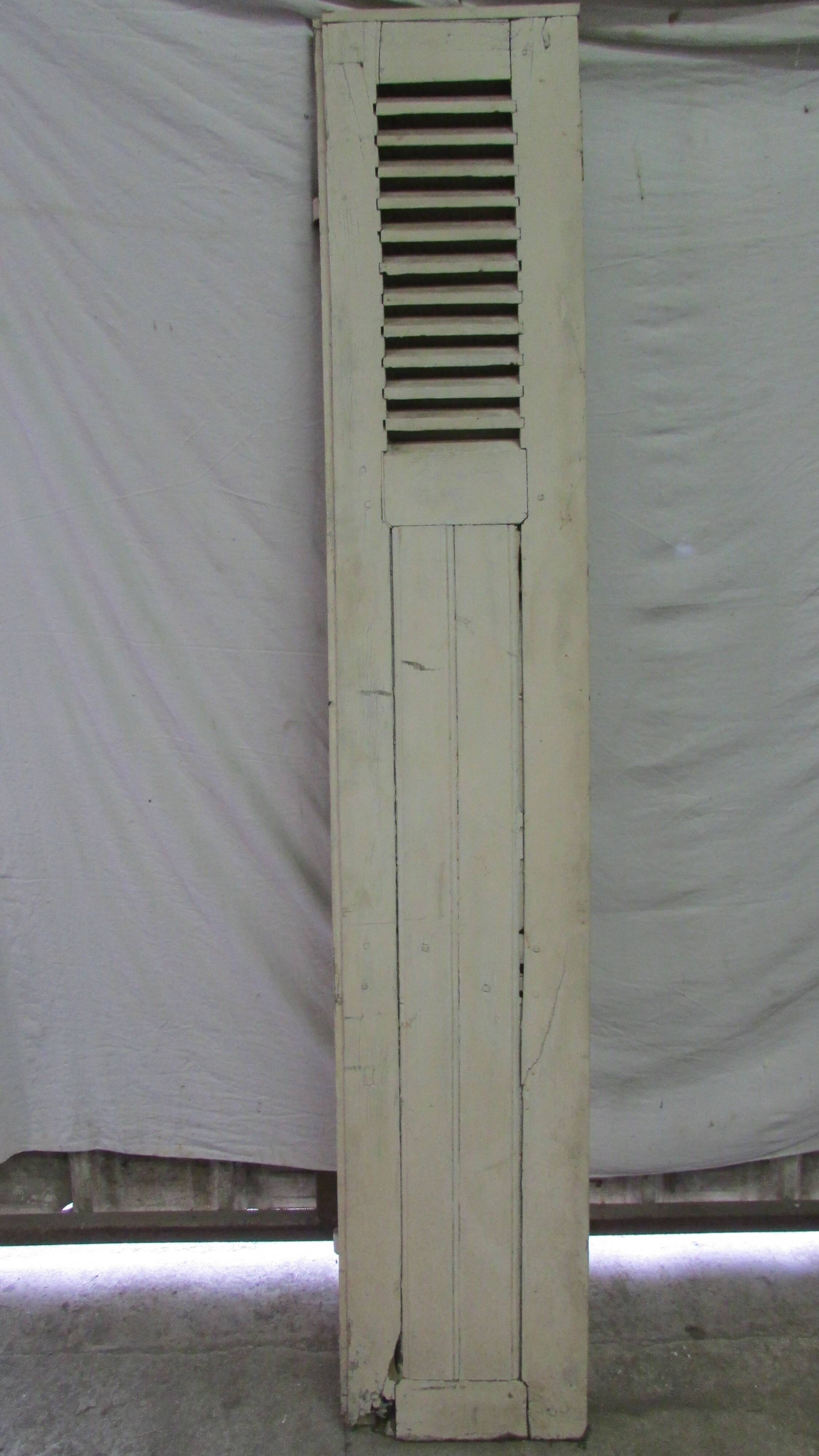 Old shutter in folding wooden louver