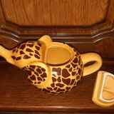Elephant teapot decorated with giraffe cheetah, signed by the brand elephant 1896