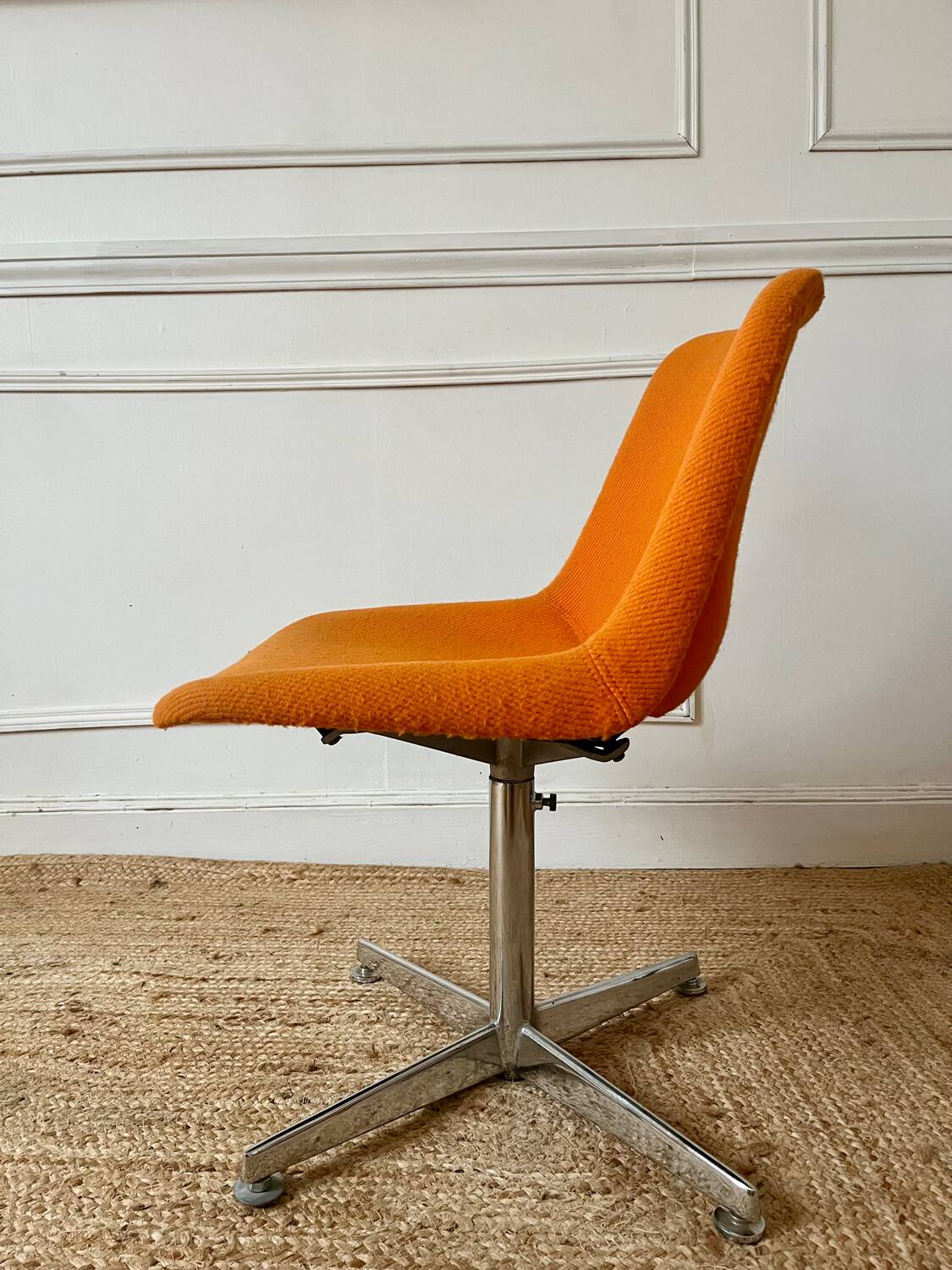 Chrome metal chair with orange fabric from the 70s.