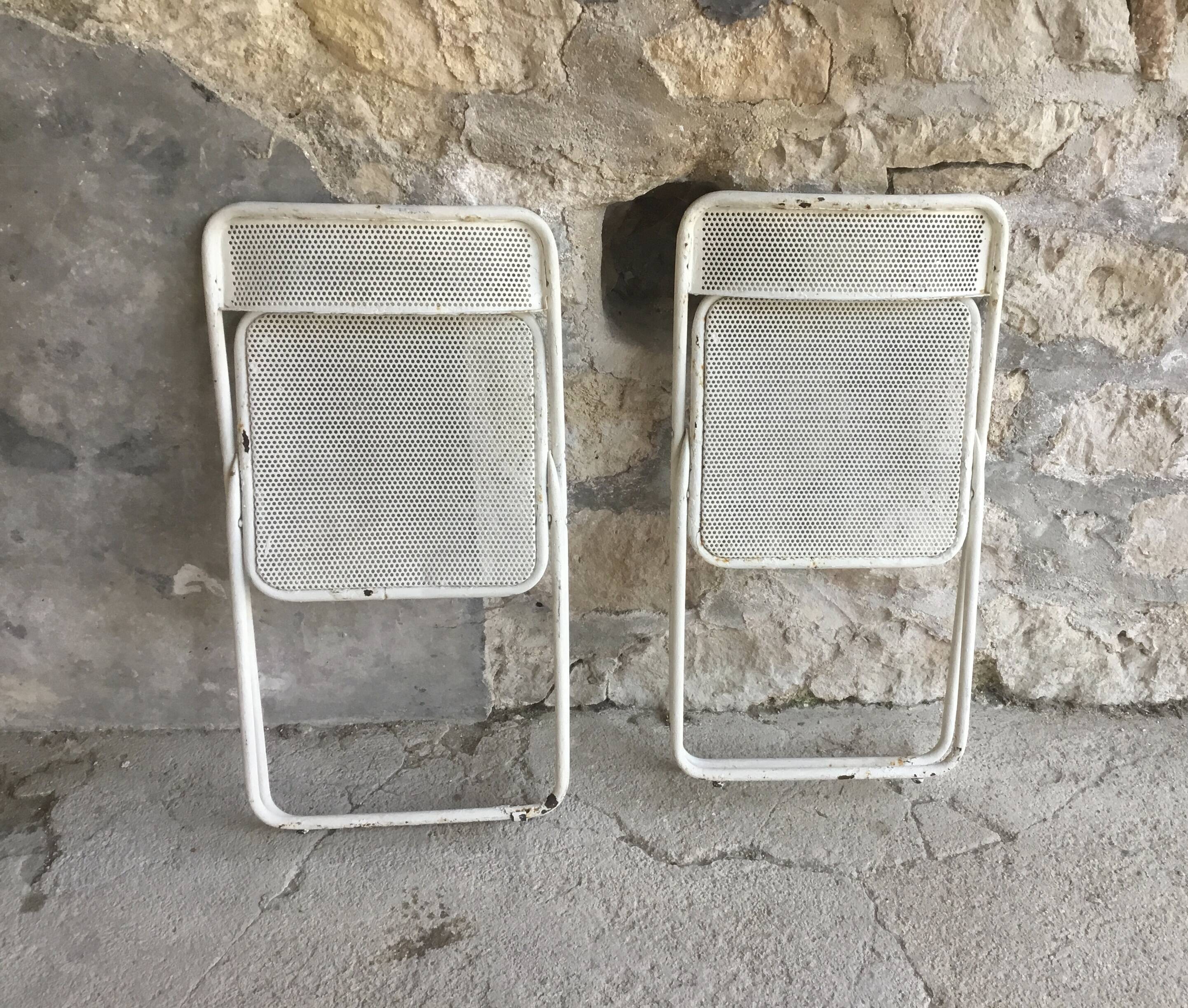 Pair of white perforated metal folding chairs - vintage