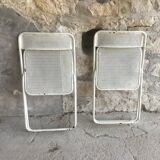 Pair of white perforated metal folding chairs - vintage