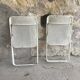 Pair of white perforated metal folding chairs - vintage
