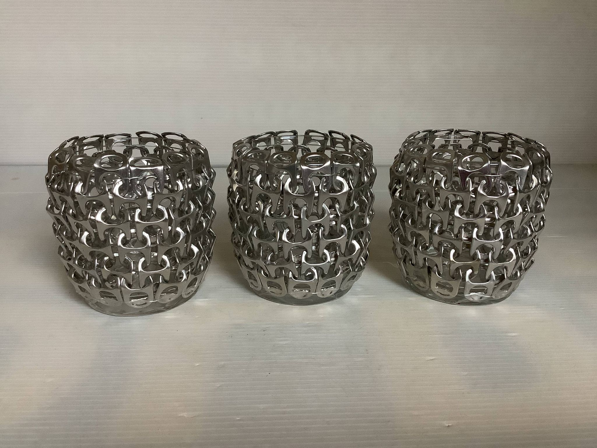 Trio of candle holders in metal strips folk art