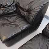 Vintage corner sofa composed of 3 modules in black leather with integrated bed.