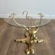 Coffee table model with cranes surrounding a brass bonsai and round glass top by Willy Daro.