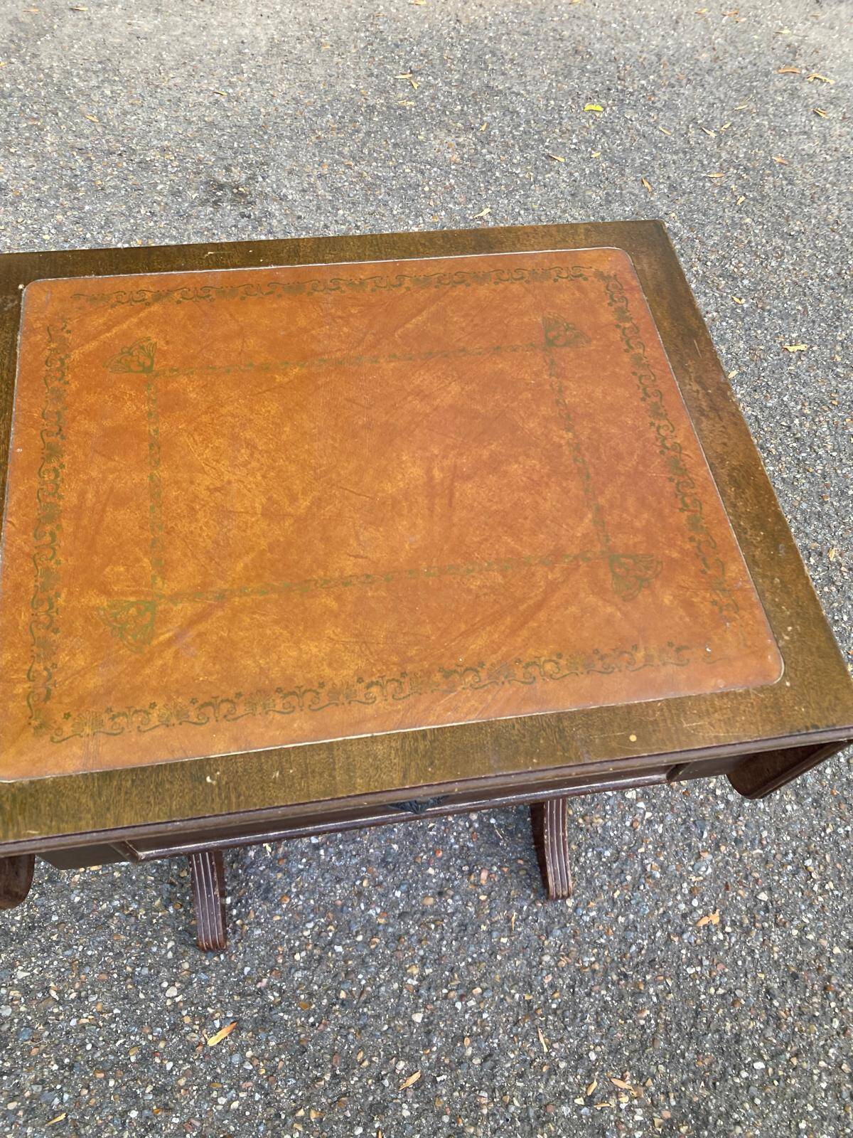 Small drop-leaf side table in English style with leather top & drawer.