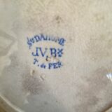 7 matching dessert plates in red green and blue.