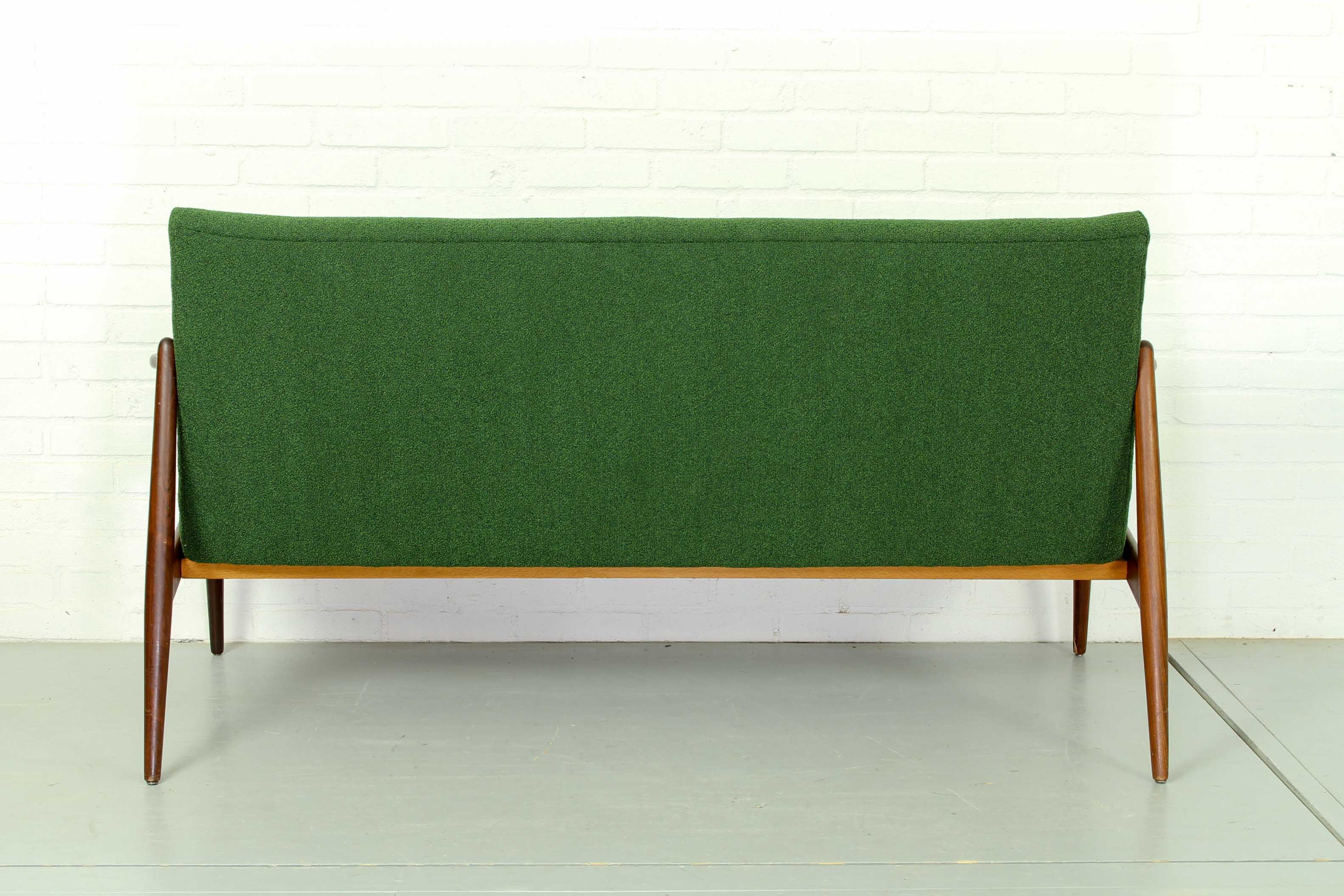 Dutch mid century 2-seater sofa with  teak legs and armrests