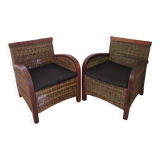 2 colonial-style armchairs in woven rattan and exotic wood