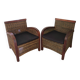 2 colonial-style armchairs in woven rattan and exotic wood