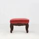 Baroque style foot stool in carved wood with coral velvet upholstery