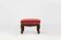Baroque style foot stool in carved wood with coral velvet upholstery