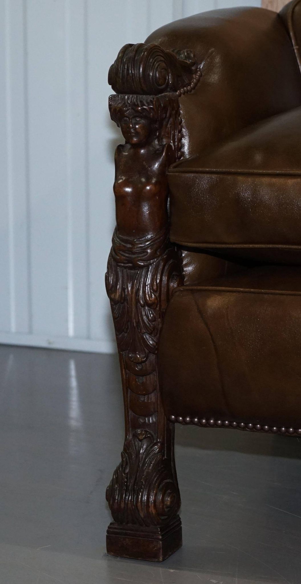 Restored Regency canapé in leather with sculpted Hermès frame.