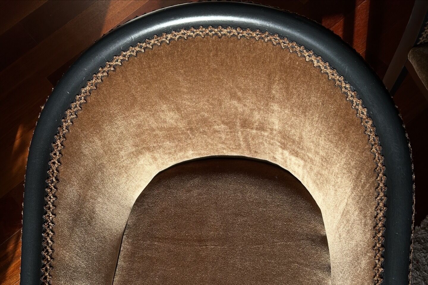 Pair of Art Deco barrel chairs in black and bronze